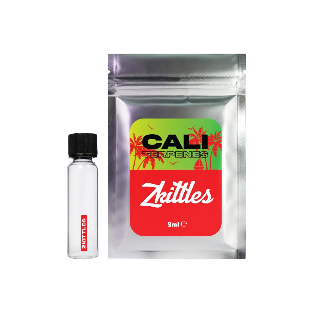 A product photo showing a clear glass vial with black cap and red “Zkittles” logo alongside a silver metallic pouch labeled “CALI TERPENES” featuring palm trees and tropical design elements. Contains 2ml.